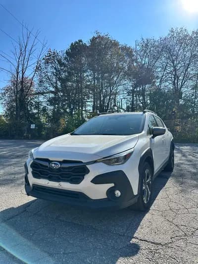 Clean Carfax, non-smoker 2024 Subaru Crosstrek Touring in White with Gray interior, front three quarter view