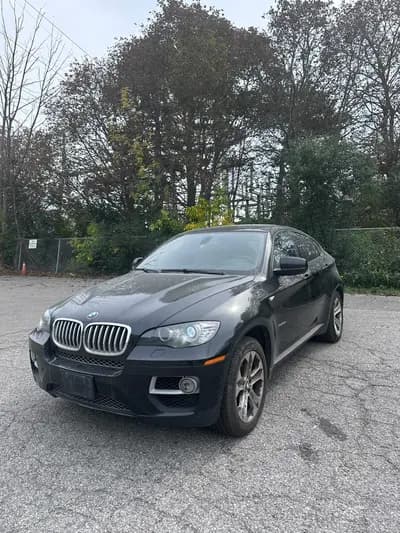 2013 BMW X6 xDrive50i in Black with Brown interior, front three quarter view