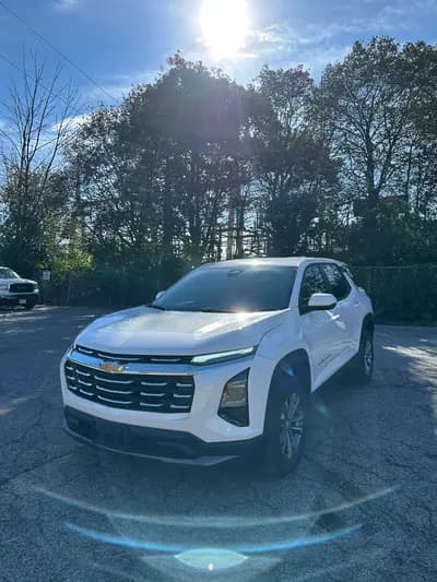 non-smoker 2026 Chevrolet Equinox LT in Pearl White with Gray interior, front three quarter view